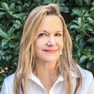 Portrait of Joanna Gustafson, founder of Keep Your Memory, smiling in natural light